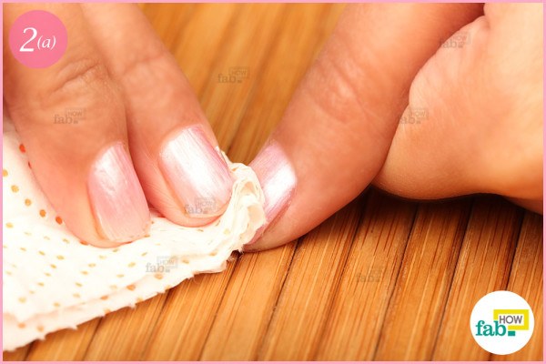Clean nails using paper towel