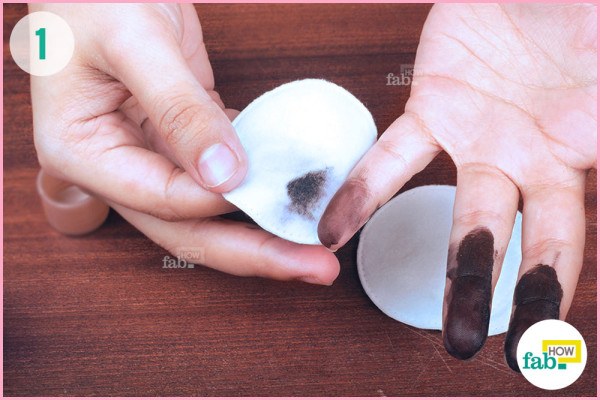 Soak cotton pad in nail polish remover