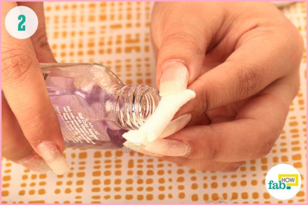 Soak pad with nailpolish remover