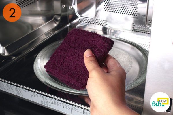 Microwave the wet towel for 2 minutes on high