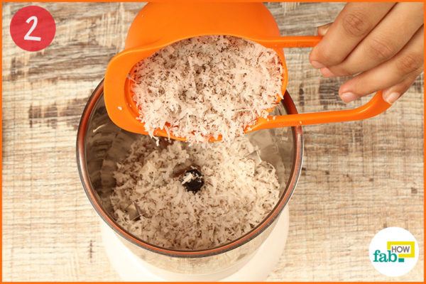 Put grated coconut into a blender
