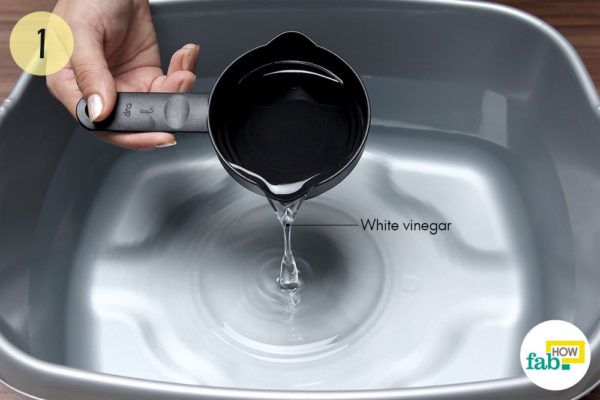 Combine of 1 cup of white vinegar with 120 fl oz of lukewarm water