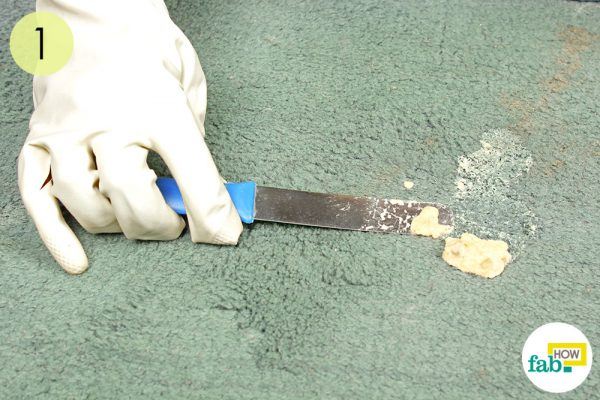 scrape away the excess to get rid of vomit stains from carpet