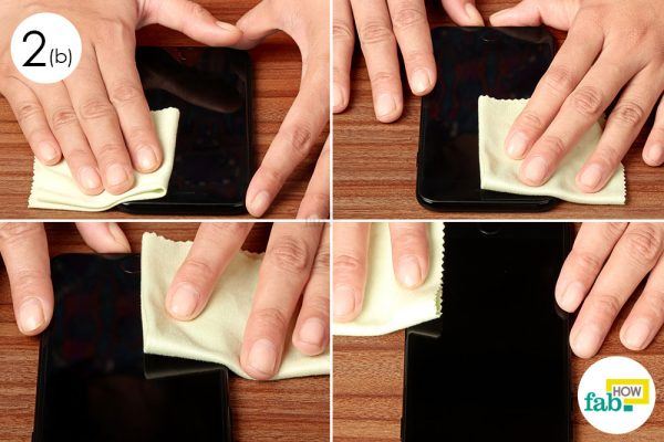 wipe the iphone screen with microfiber cloth