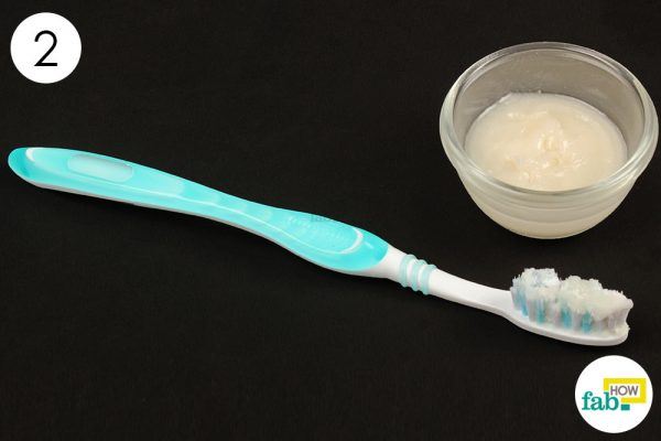 brush your teeth with baking soda and coconut oil paste
