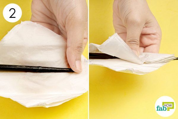 wipe off the loosened superglue to remove it from the plastic