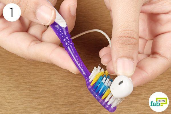 brush the debris out of earbud filters