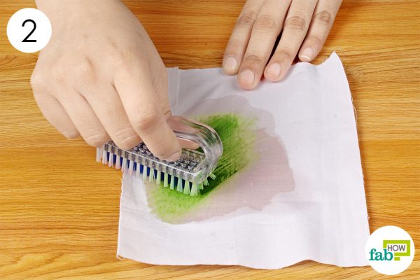 scrub the stain with a cleaning brush