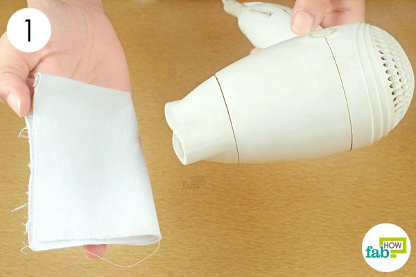 heat up a cotton cloth with a blow dryer