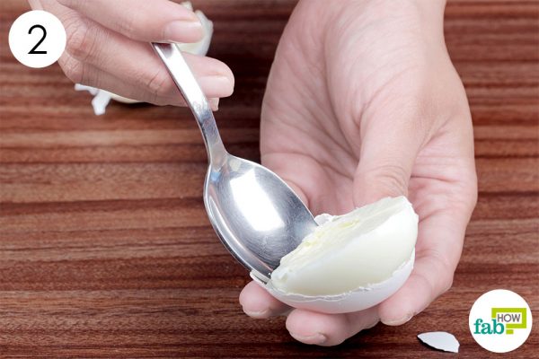 scoop out the egg with a spoon