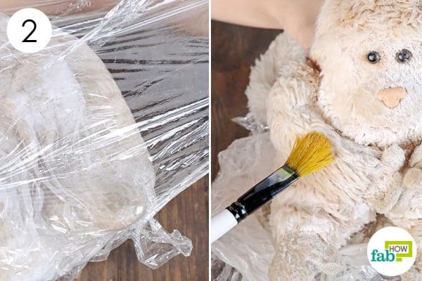 Unwrap and brush off the baking soda to clean stuffed toys