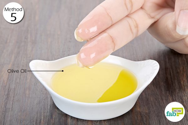 massage babys tummy with olive oil